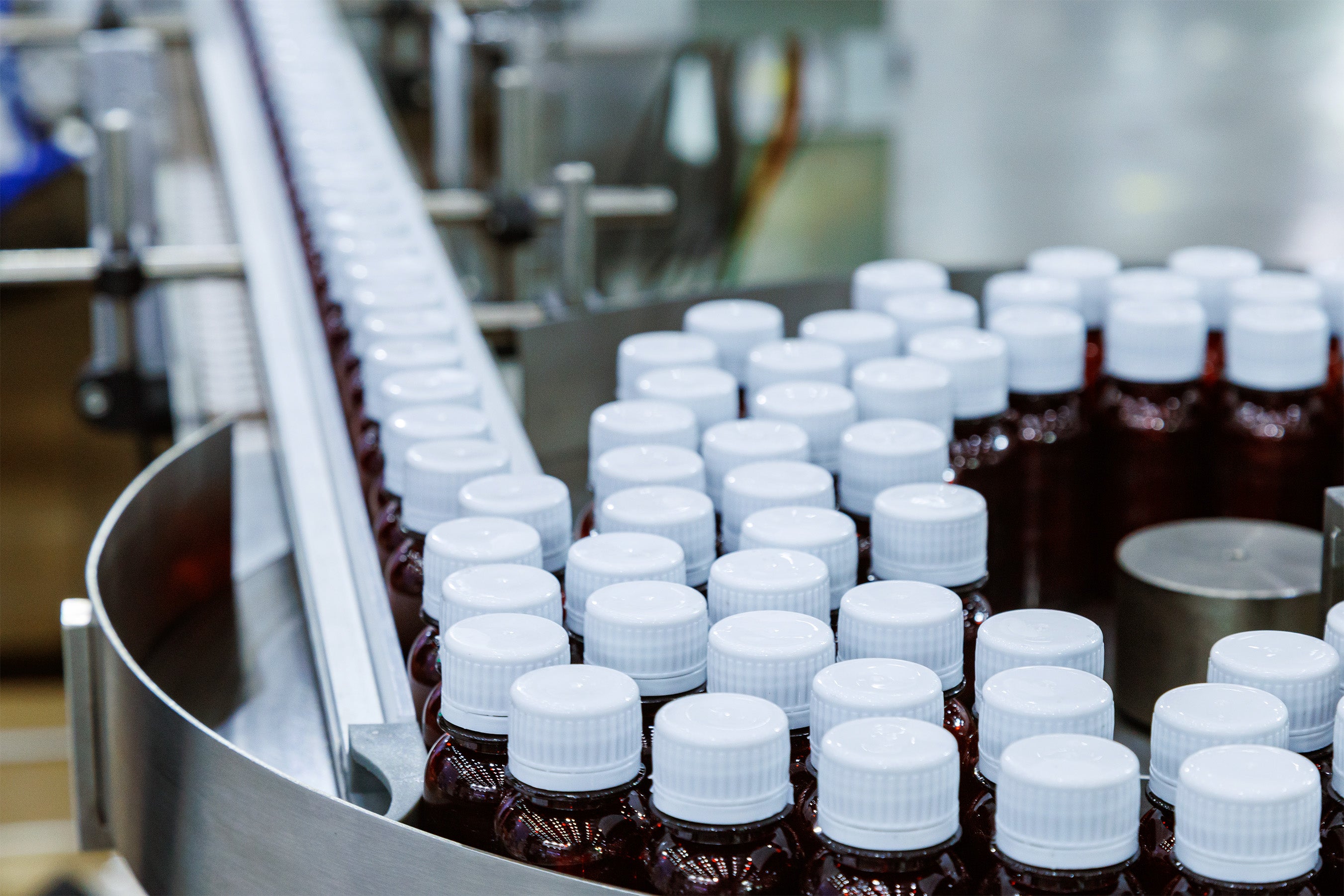 supplements health bottles on automated bottling line in factory