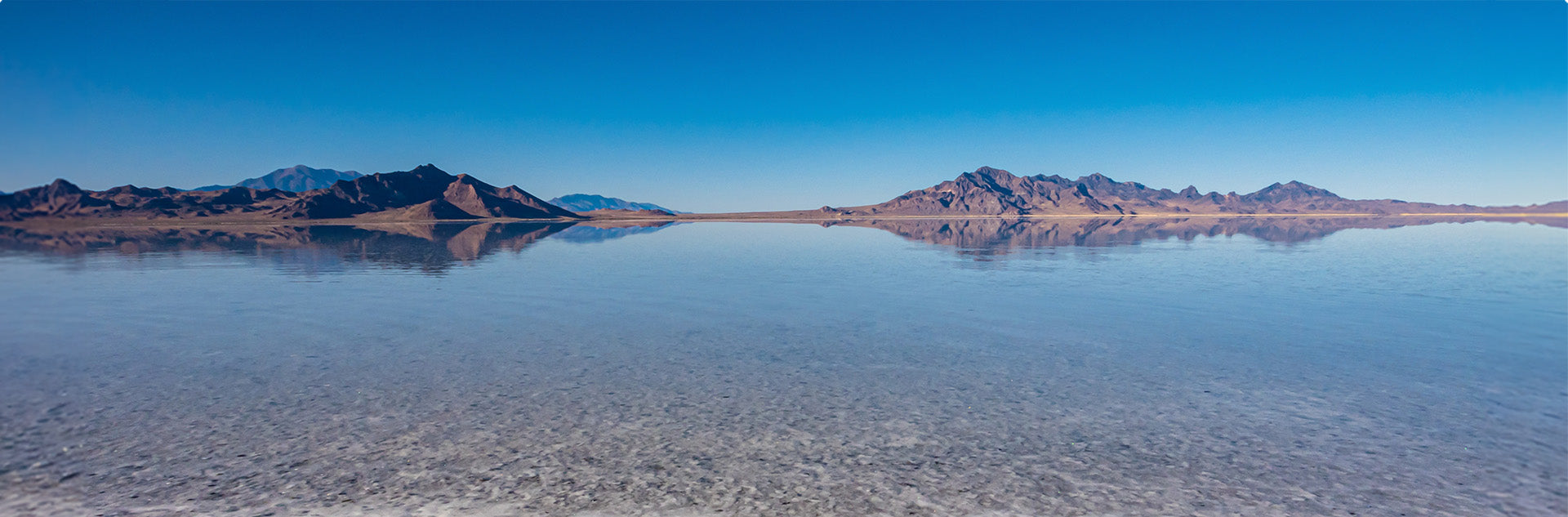 supplements health mountain landscape reflecting on clear blue water under bright sky